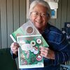 Candi Lordo is pictured with copies of “Missouri Life” which features her cookie recipe for Mrs. Schemes’ Chocolate Chip Graham Cracker Brownies. The top magazine displays a photo of the brownie.