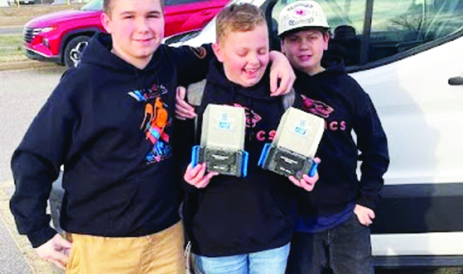 Courtesy of Reeds Spring School District. 
Above: Reeds Spring Middle School students Ethan McKinney, Taylor Lanham, and Will Carpenter show off their robotics awards.