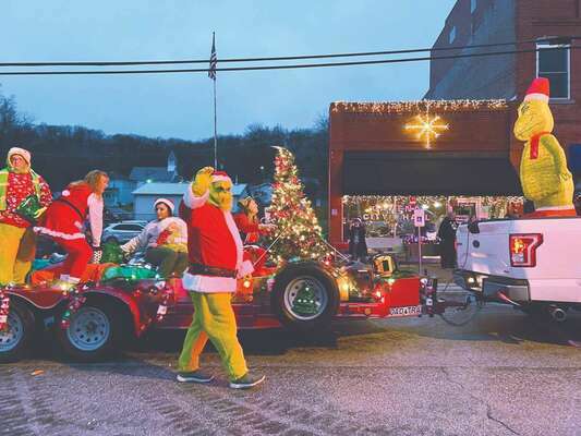 The Grinch waves to crowd during the parade. Photo courtesy of Kadee DeCourley.